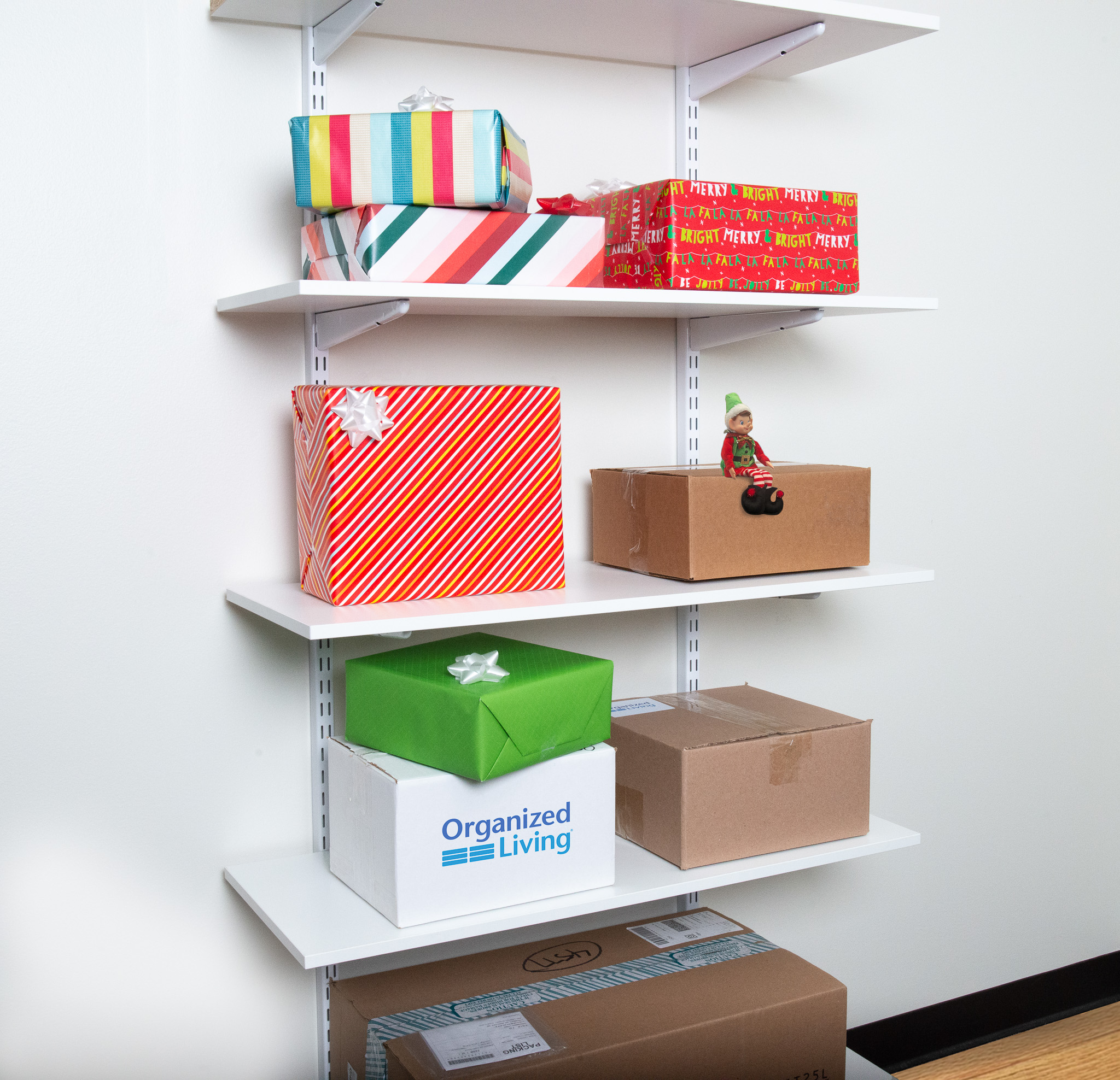 freedomRail Shelf Stack in White with packages and elf.