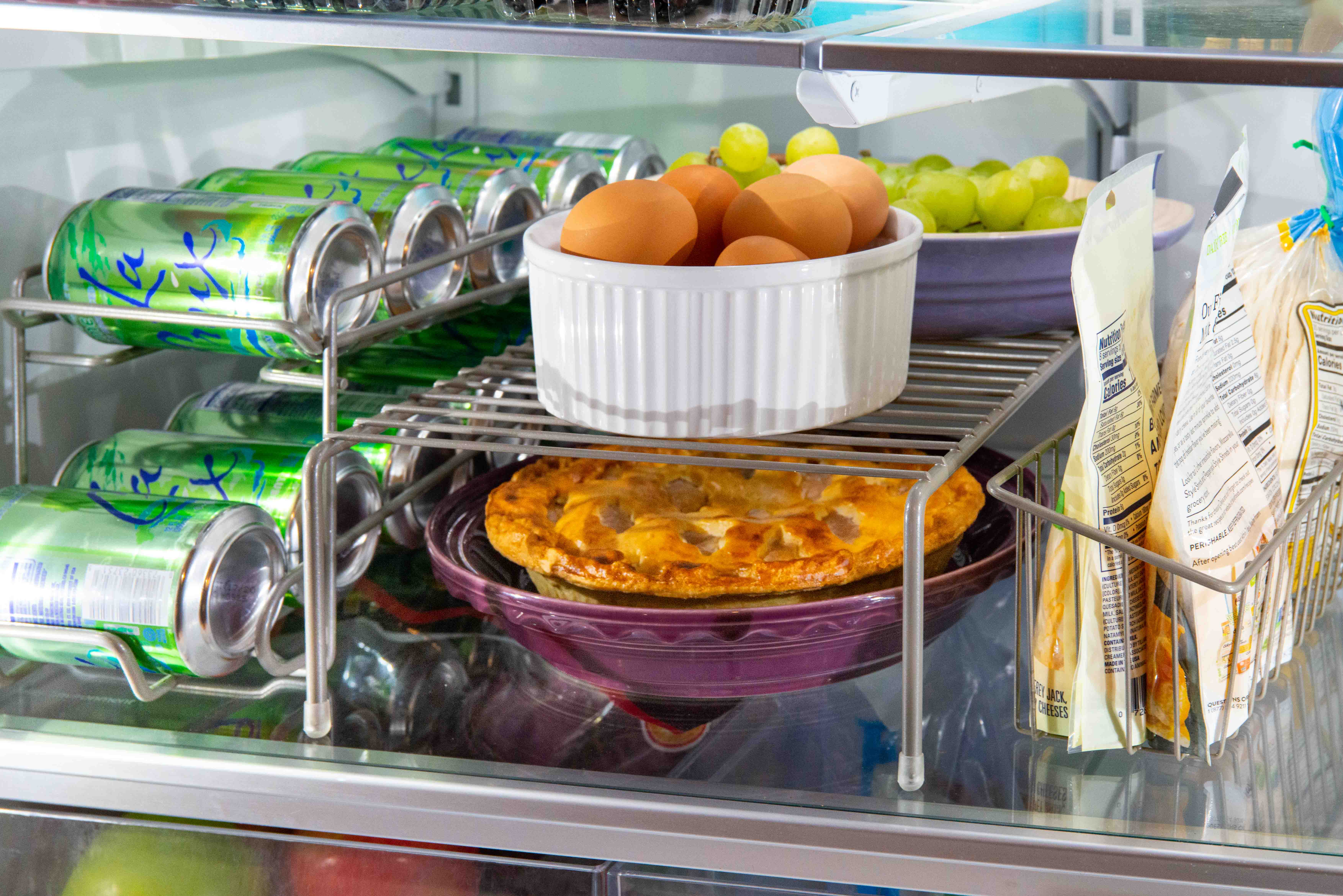 Kitchen Organizers in Nickel inside refrigerator with drinks and meal prep.