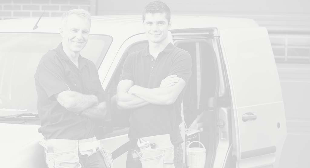 Two installing dealers in front of vehicle