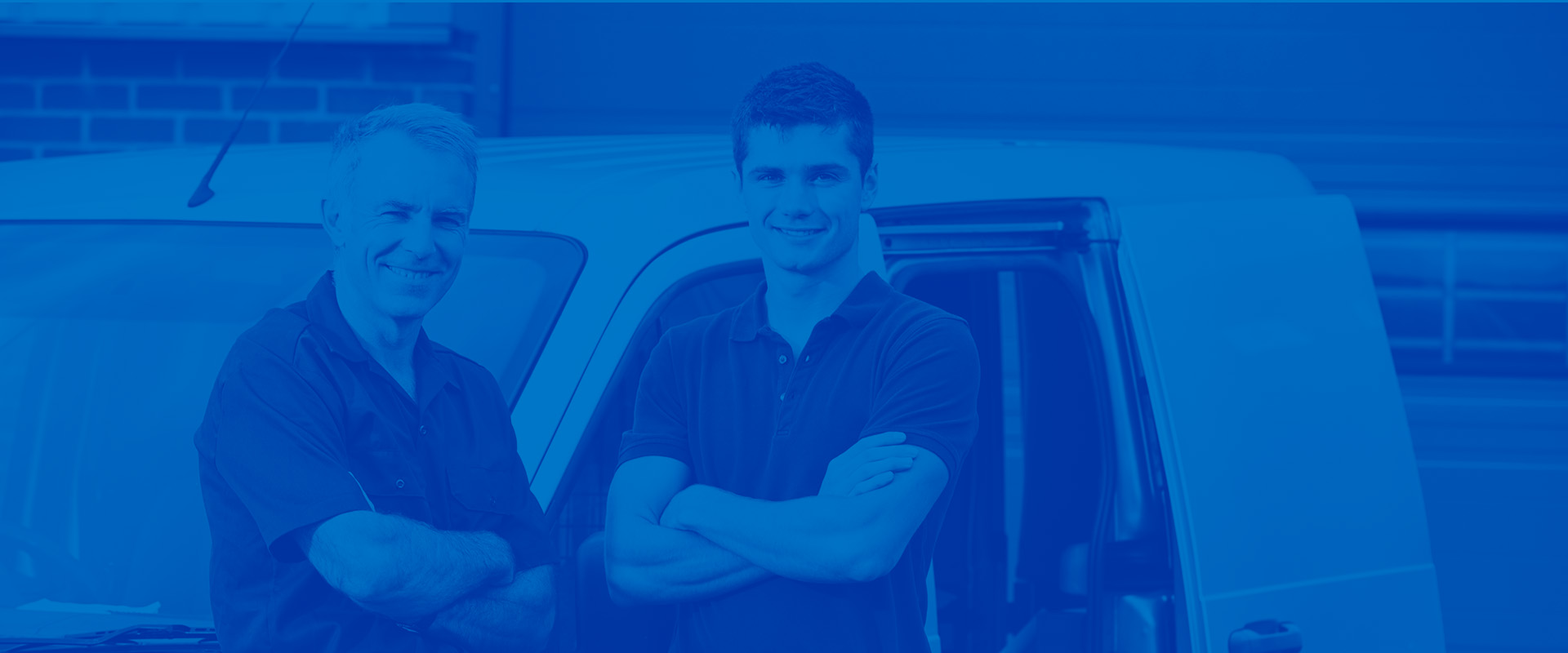 Two closet installing dealers in front of vehicle.