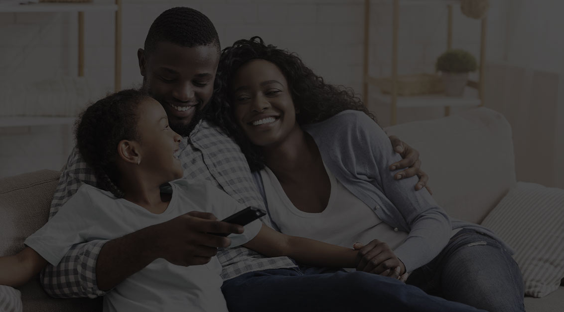 Family Sitting on Couch