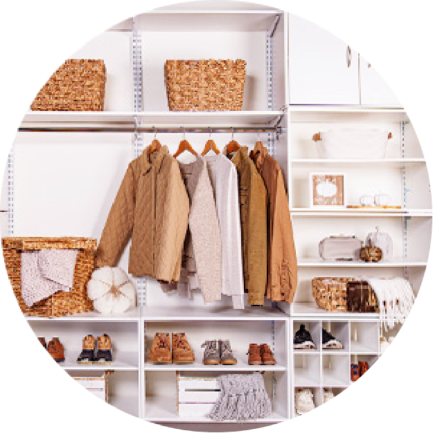 White entry Built-in closet area propped with fall clothing and accessories.