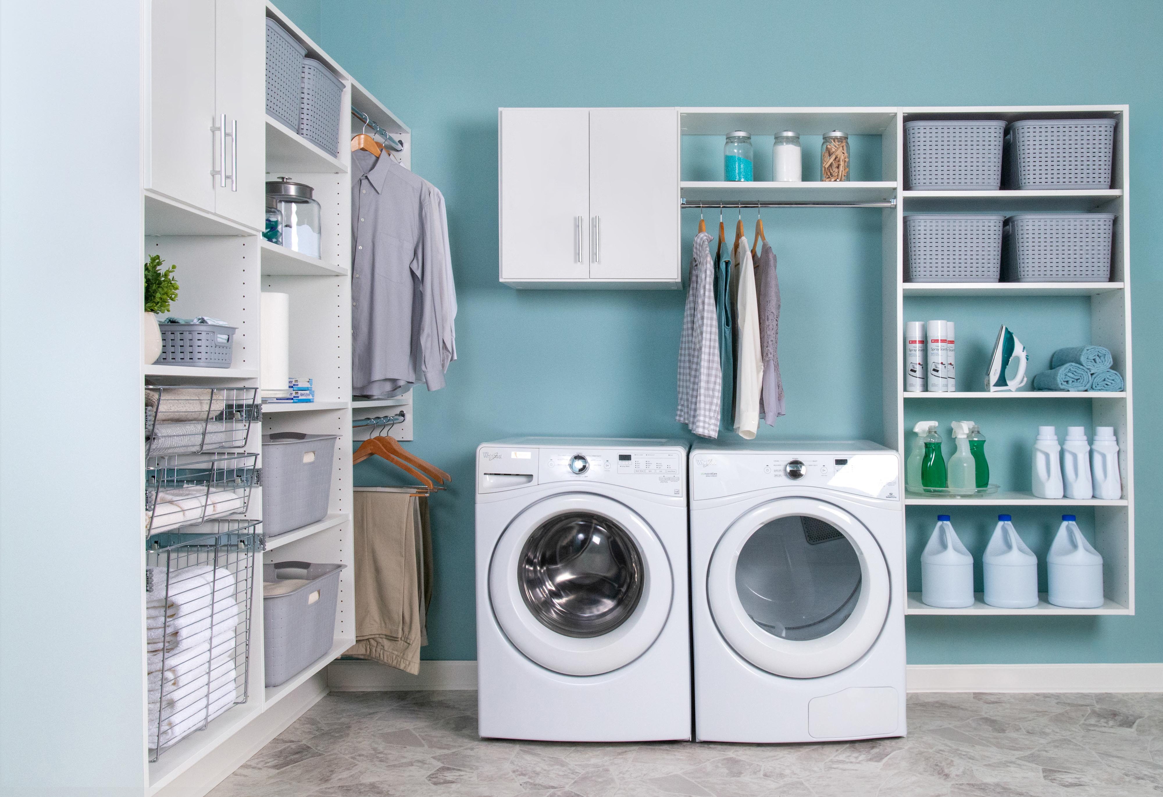 Select Laundry Room in White with steamer, baskets, and blue walls.